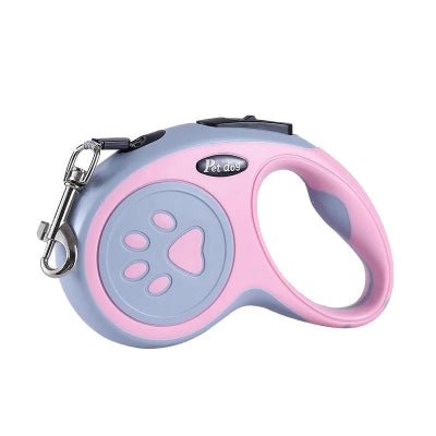 laisse pour chien enrouleur rose motif pattes